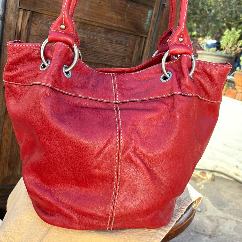 Tignanello reddish pink leather shoulder bag.